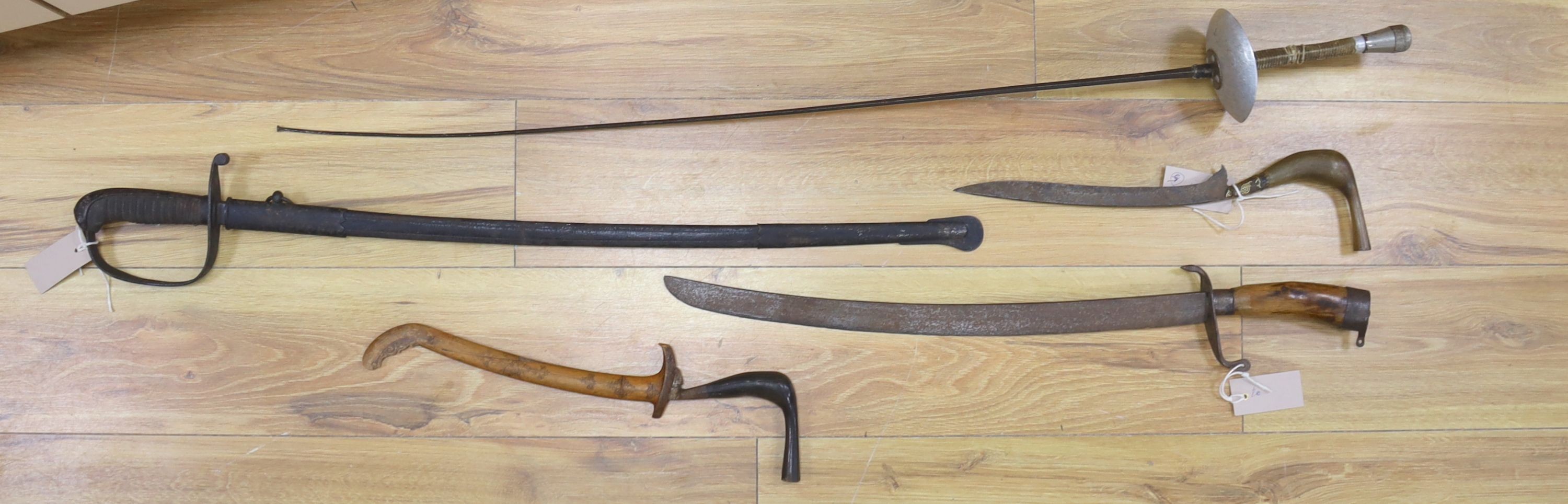 A Dutch East Indies short sword / kris having horn handle and gold inlay, another similar, a late 19th century sword and scabbard, an epee and another sword (5)